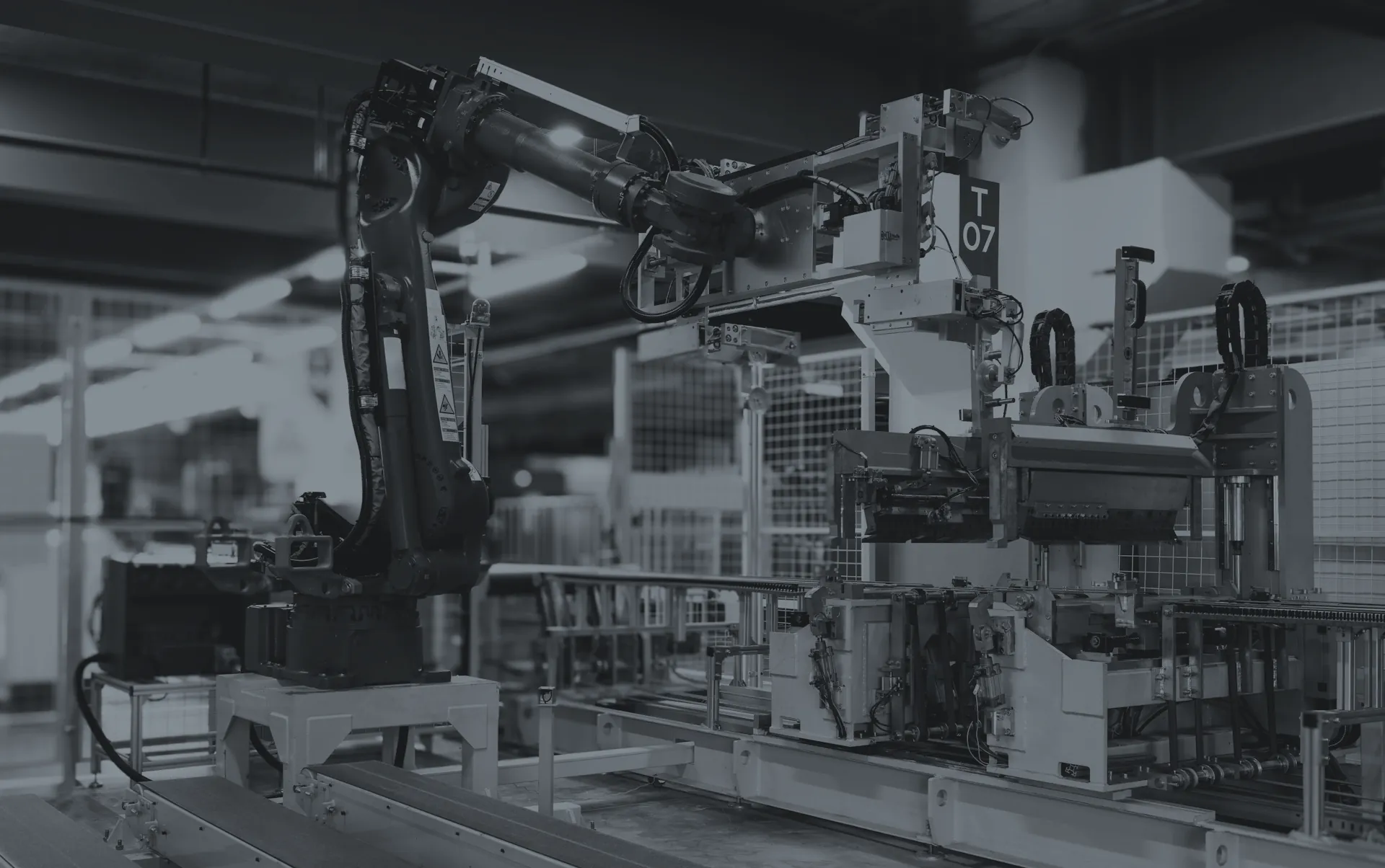 Robotic cell with an industrial arm and workstation